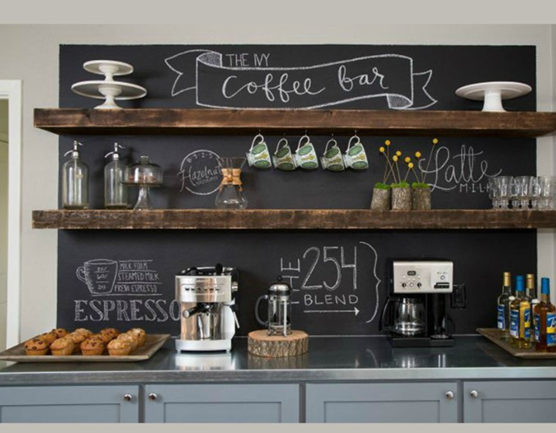 Gray-toned coffee bar table with a chalkboard backdrop